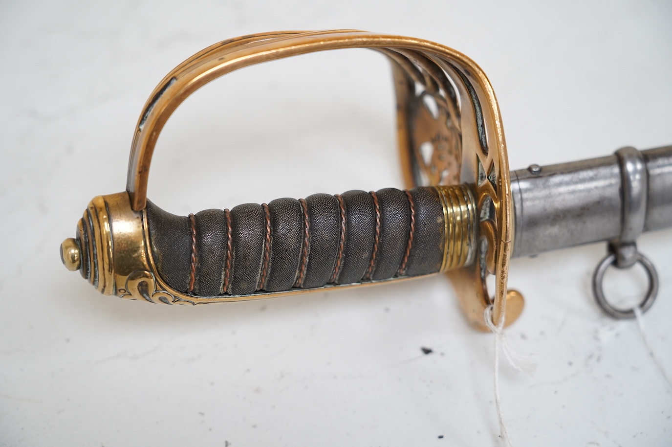 A Victorian 1845 pattern British Infantry Officer’s sword, by Hills Brothers of Old Bond Street, London, solid brass hilt in its steel dress scabbard, blade 81cm. Condition - fair, generally worn.